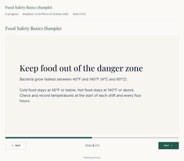 A learner viewing a training slide about food temperature safety